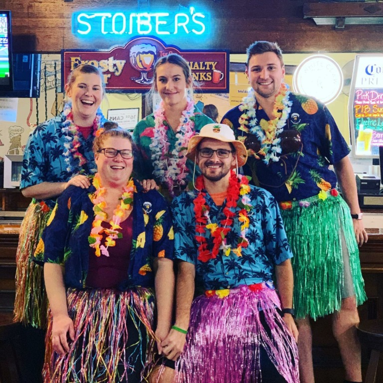 five staff members in front of the bar at frosty's